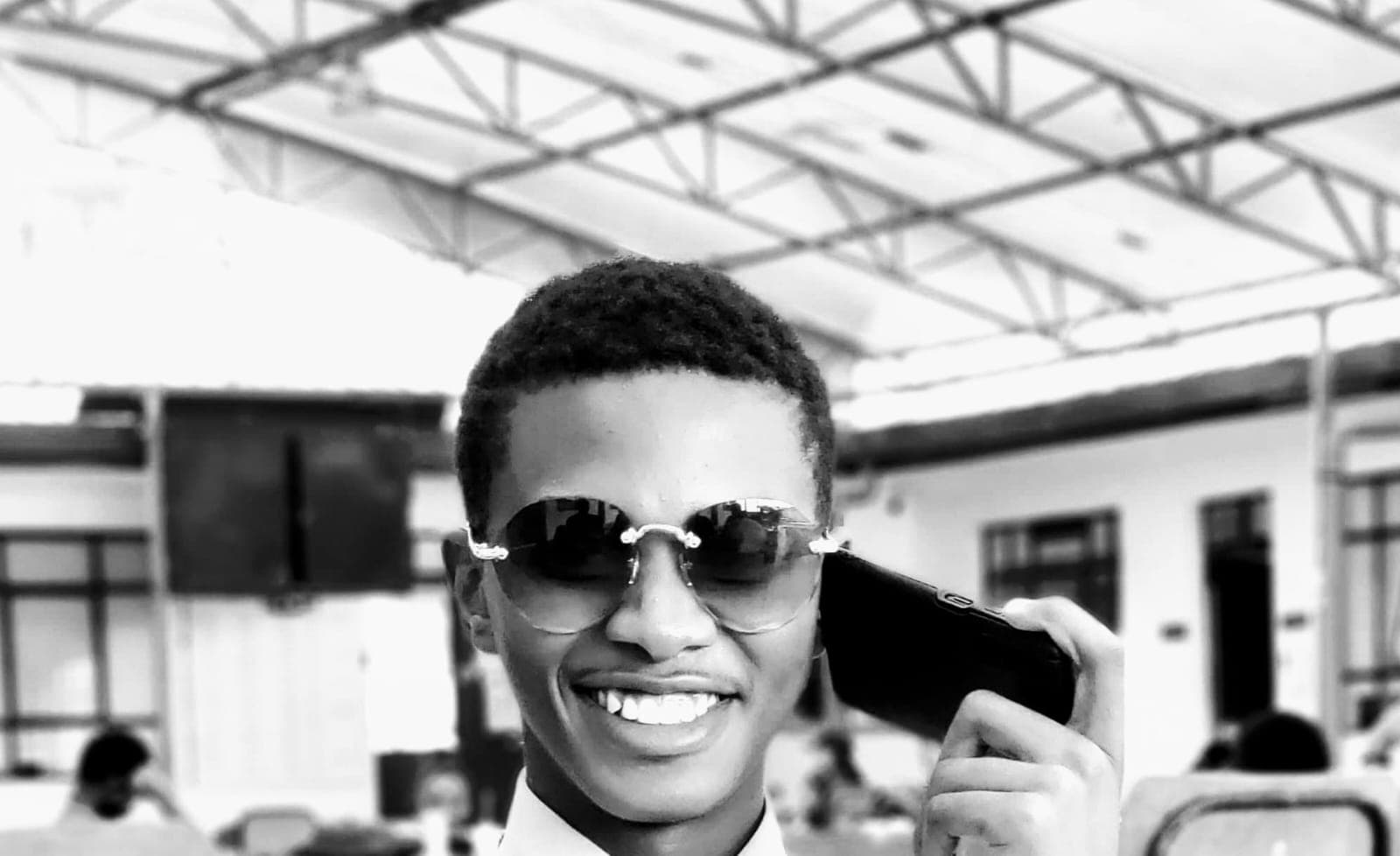 Njaji Samson Sibona in a modern architectural space.